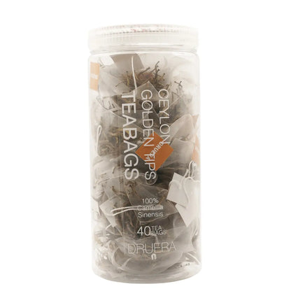 Golden Tips premium Ceylon tea bags with whole golden buds and rich amber brew