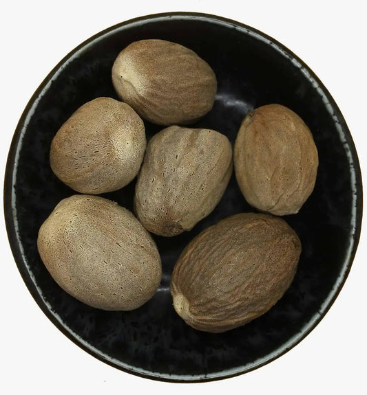 Aromatic whole nutmeg spice for baking, drinks, and rich culinary flavor